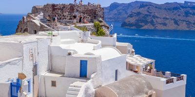 OIA, SANTORINI, GREECE - JUN 21, 2012: Beautiful architecture of Oia town on Santorini island in Greece. Santorini is one of the most popular tourist destinations in Greece.